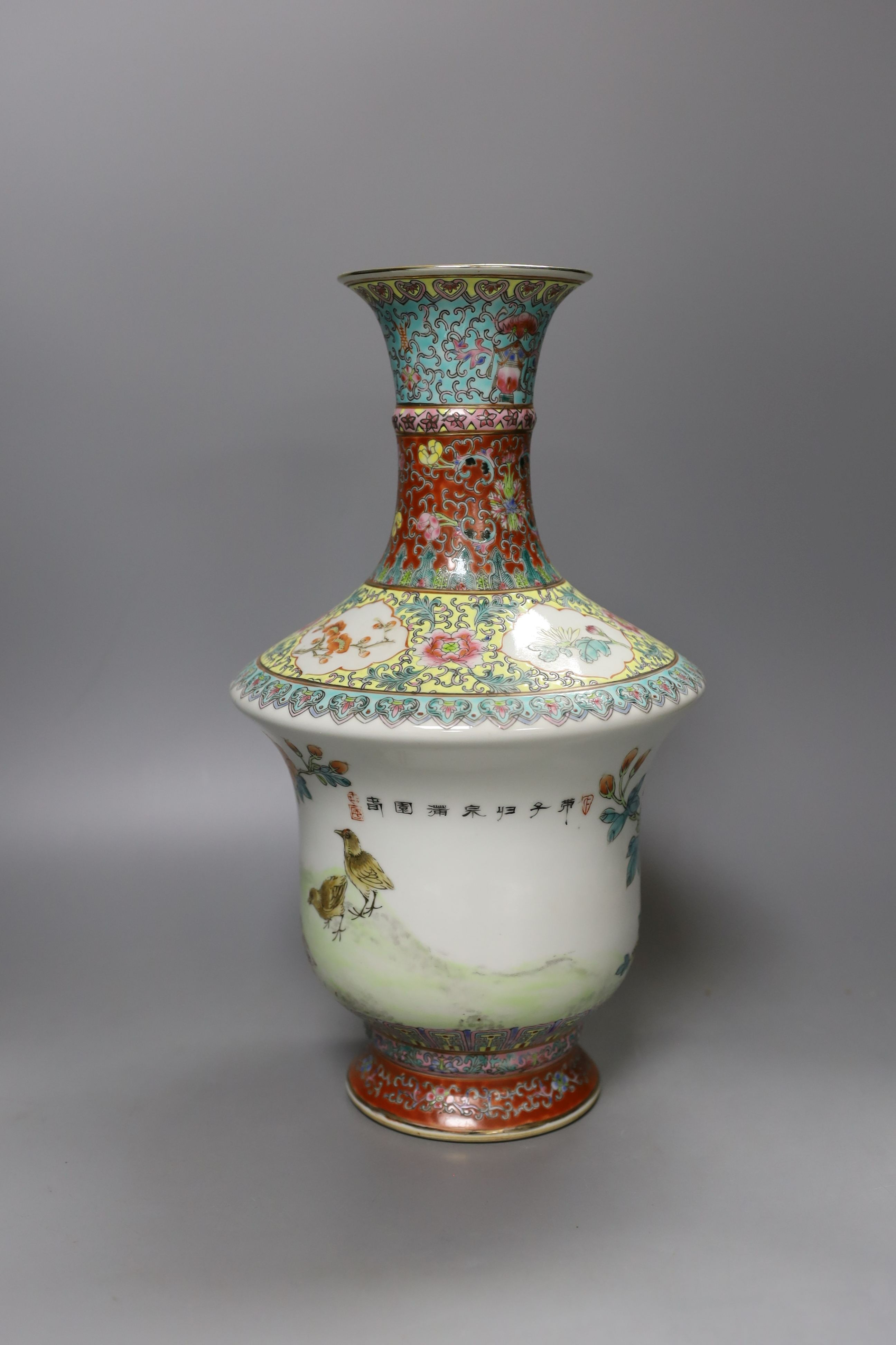 A Chinese famille rose vase, 20th century with drilled base mark - 33cm tall